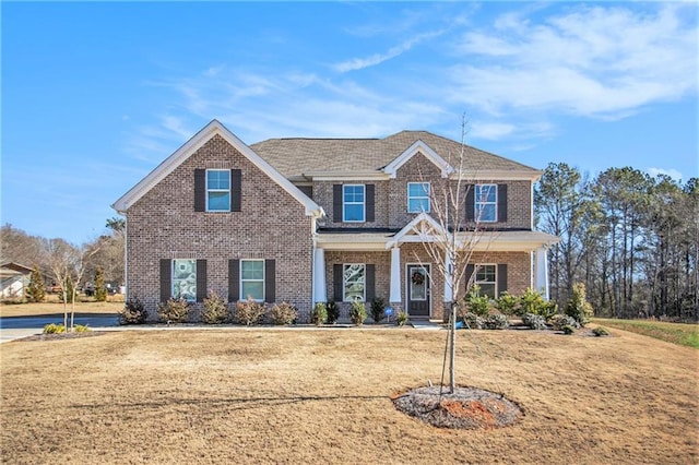 craftsman-style home featuring a front yard