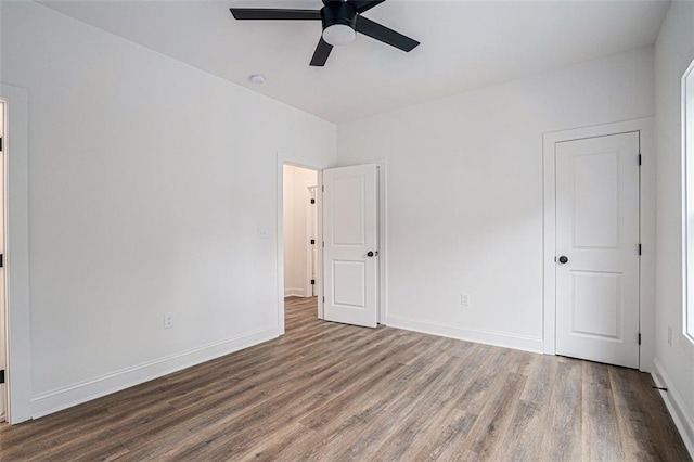 empty room featuring hardwood / wood-style floors and ceiling fan