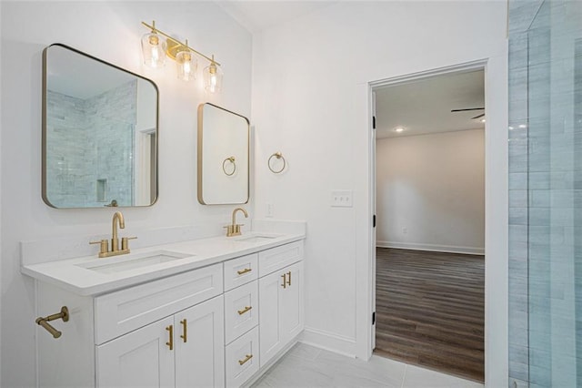 bathroom with a shower and vanity