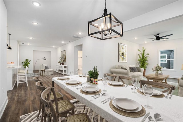 dining area with ceiling fan and dark hardwood / wood-style flooring