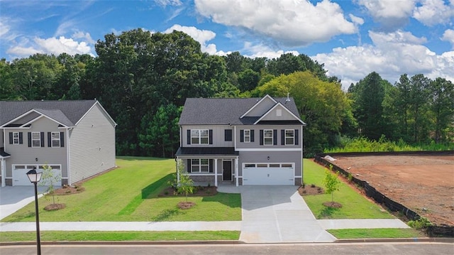view of front of home featuring a front yard, a garage, and driveway