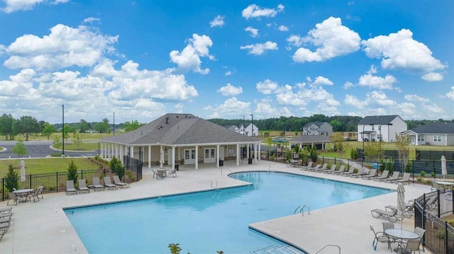 pool featuring a patio and fence