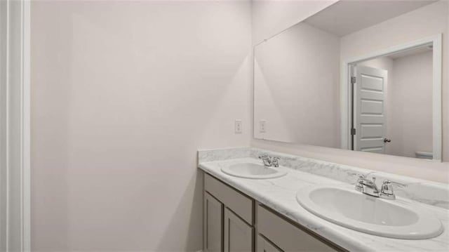 bathroom with double vanity and a sink
