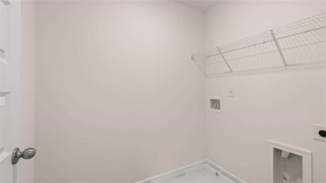 laundry room featuring laundry area, hookup for a washing machine, and hookup for an electric dryer