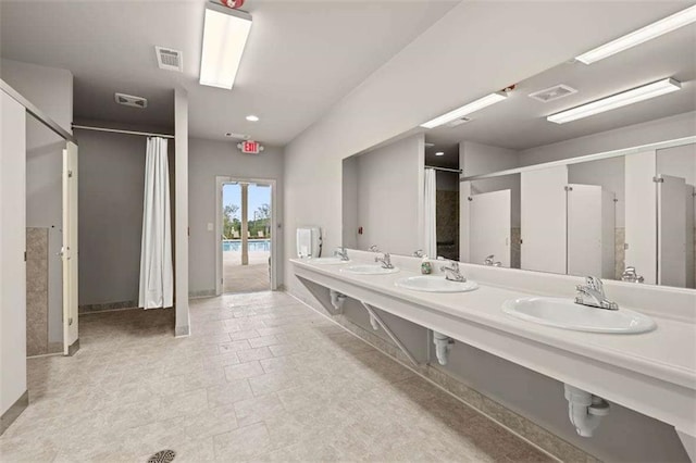 full bath featuring visible vents and a sink