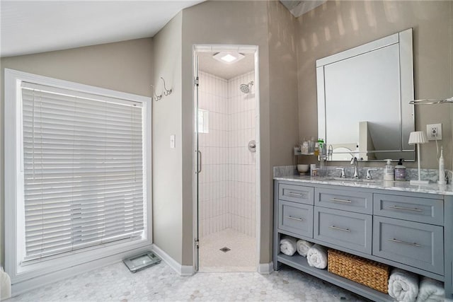 614 Cooledge Ave NE, Atlanta, GA 30306 - full bath with a stall shower, vanity, baseboards, and vaulted ceiling