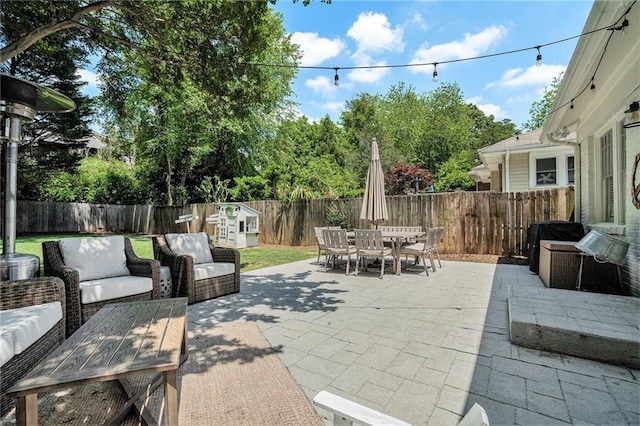 614 Cooledge Ave NE, Atlanta, GA 30306 - view of patio featuring outdoor dining area, a fenced backyard, and outdoor lounge area