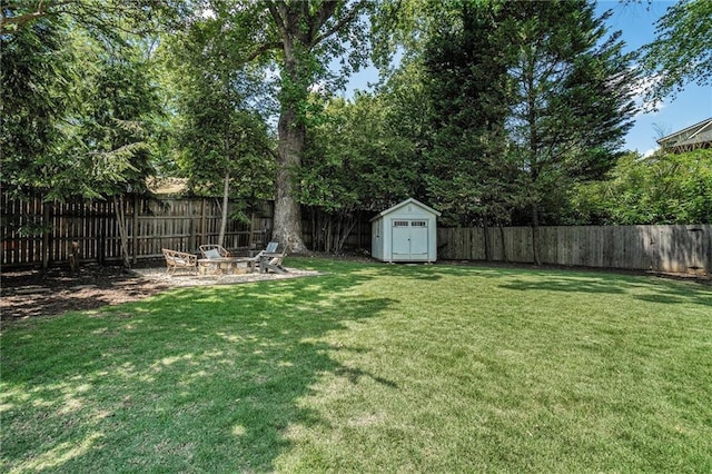614 Cooledge Ave NE, Atlanta, GA 30306 - view of yard featuring an outdoor fire pit, a storage unit, and an outbuilding