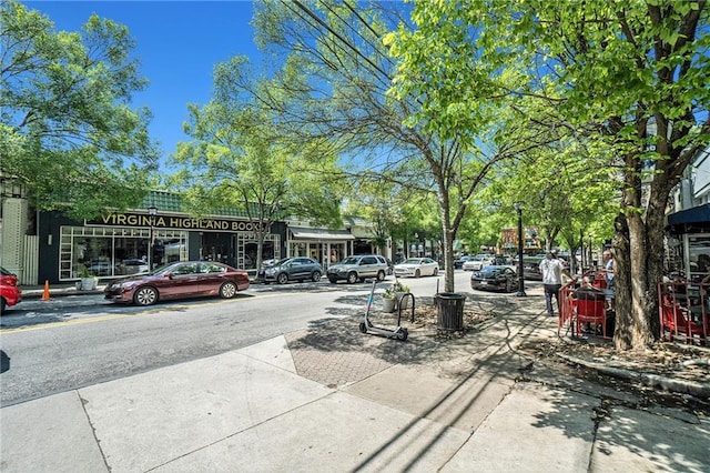 614 Cooledge Ave NE, Atlanta, GA 30306 - view of asphalt road featuring sidewalks, curbs, and street lights