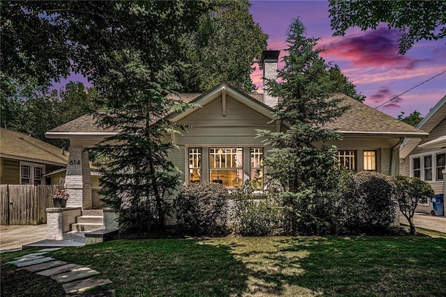614 Cooledge Ave NE, Atlanta, GA 30306 - view of front facade featuring a chimney and roof with shingles