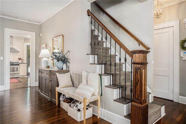 614 Cooledge Ave NE, Atlanta, GA 30306 - staircase with wood finished floors, crown molding, a chandelier, and baseboards