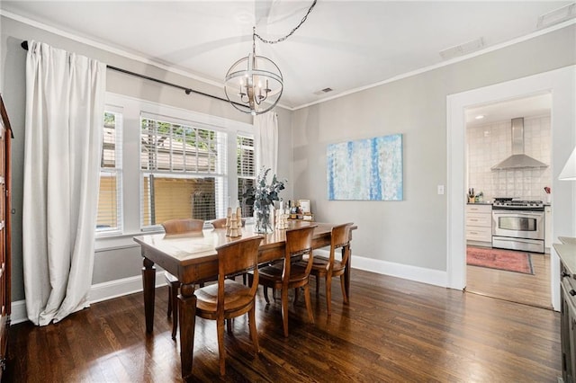614 Cooledge Ave NE, Atlanta, GA 30306 - dining space with a chandelier, ornamental molding, baseboards, and dark wood finished floors
