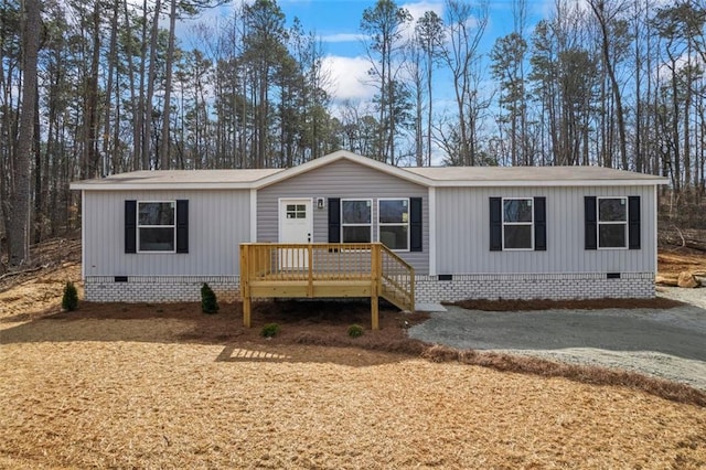 manufactured / mobile home with crawl space and a wooden deck