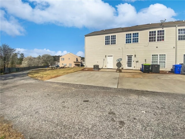 back of property featuring a patio and cooling unit