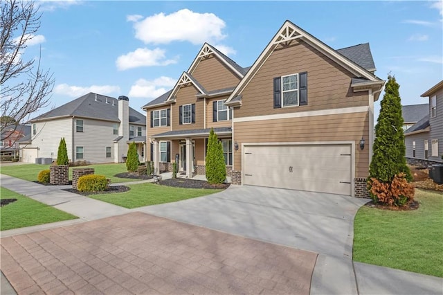 craftsman house featuring a front yard, driveway, a porch, a garage, and a residential view