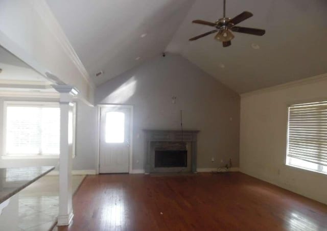 unfurnished living room featuring ceiling fan, crown molding, high vaulted ceiling, and wood-type flooring