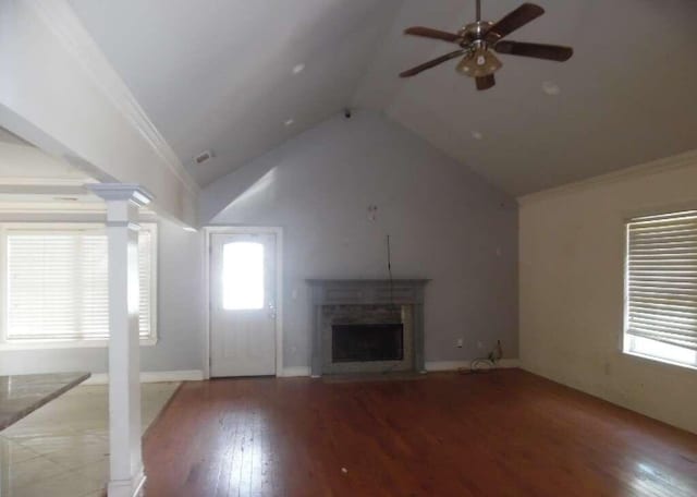 unfurnished living room with wood-type flooring, crown molding, ceiling fan, and lofted ceiling