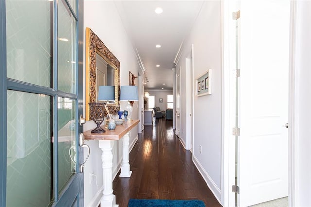 hall featuring recessed lighting, baseboards, and dark wood-style flooring