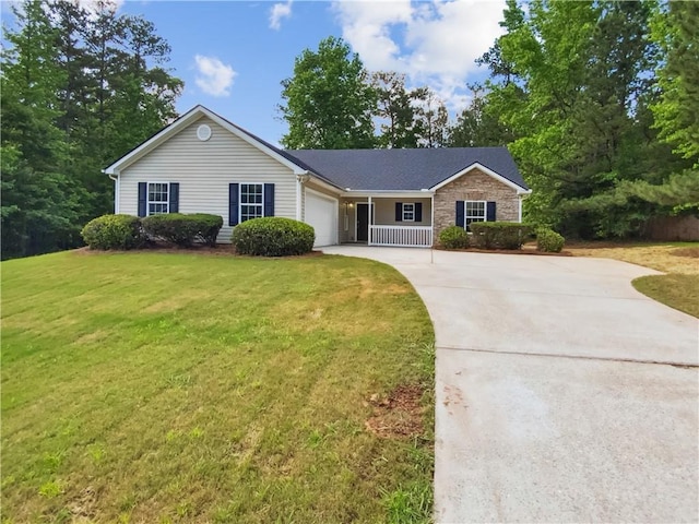 ranch-style home featuring a garage, driveway, a front yard, and stone siding