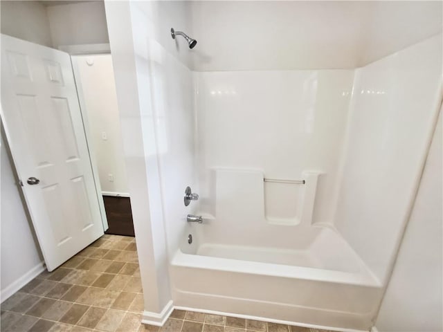 bathroom with  shower combination and baseboards