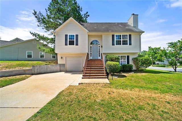 125 Fairhaven Trl, Fairburn, GA 30213 - bi-level home featuring a front yard, a garage, a chimney, and concrete driveway