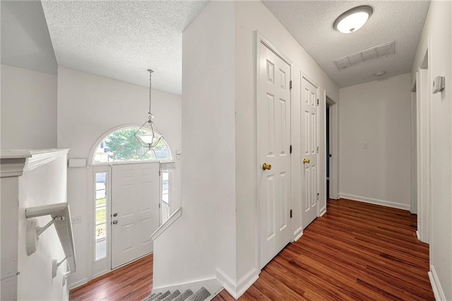 125 Fairhaven Trl, Fairburn, GA 30213 - foyer entrance featuring wood finished floors, a textured ceiling, and baseboards
