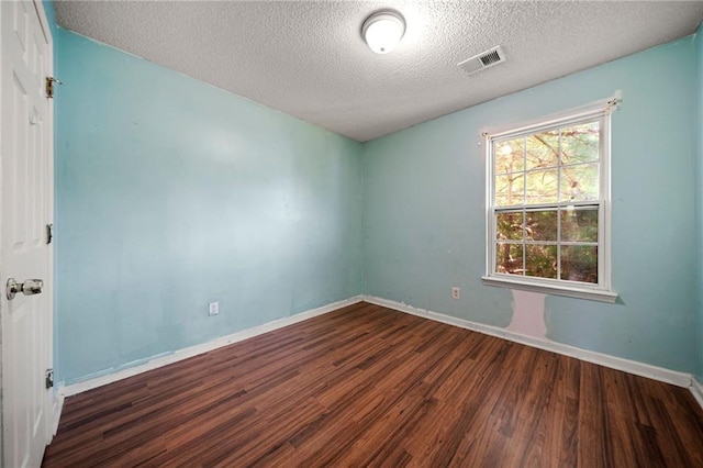 125 Fairhaven Trl, Fairburn, GA 30213 - empty room with wood finished floors, a textured ceiling, and baseboards