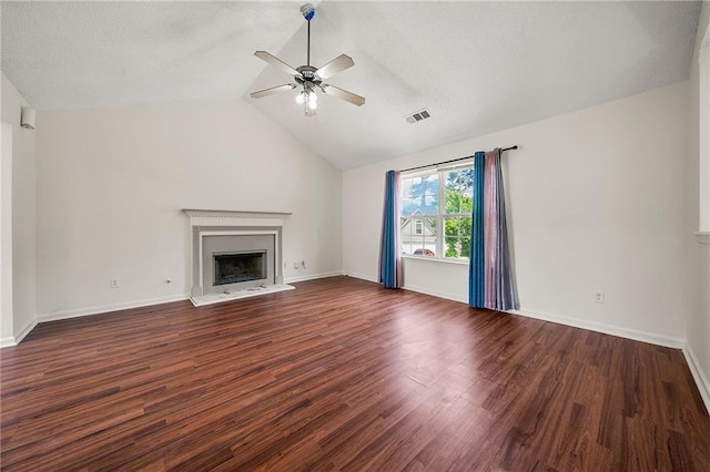 125 Fairhaven Trl, Fairburn, GA 30213 - unfurnished living room featuring a ceiling fan, a fireplace with raised hearth, wood finished floors, lofted ceiling, and baseboards