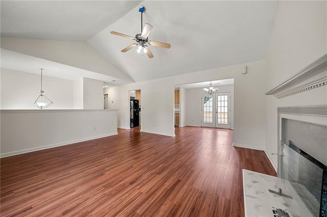 125 Fairhaven Trl, Fairburn, GA 30213 - unfurnished living room with a fireplace with flush hearth, a ceiling fan, a chandelier, wood finished floors, and baseboards