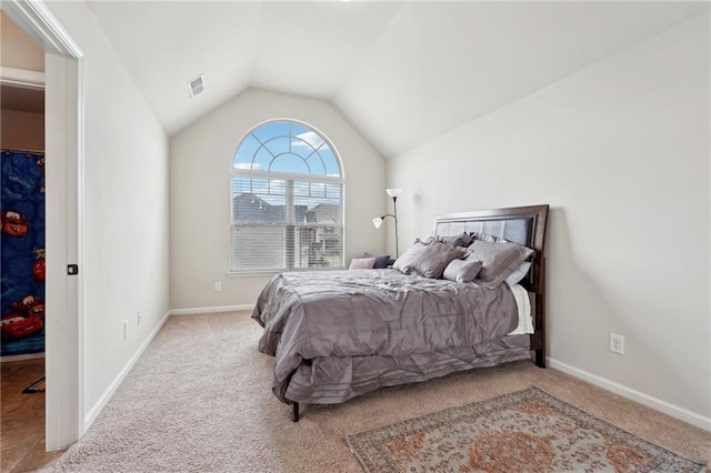 bedroom with lofted ceiling, baseboards, visible vents, and light colored carpet