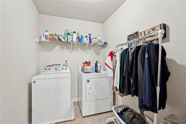 clothes washing area featuring laundry area and washing machine and clothes dryer