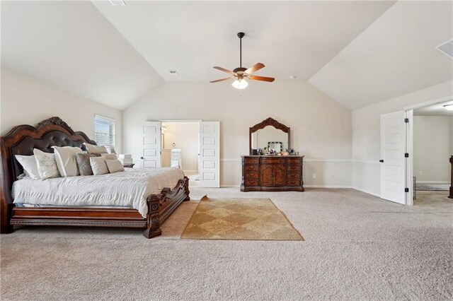 bedroom with ceiling fan, vaulted ceiling, and light colored carpet