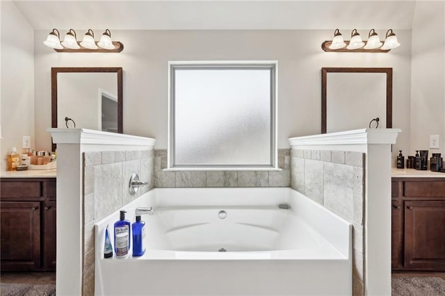 full bathroom with a garden tub and vanity