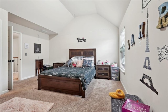 bedroom featuring light carpet, lofted ceiling, and baseboards