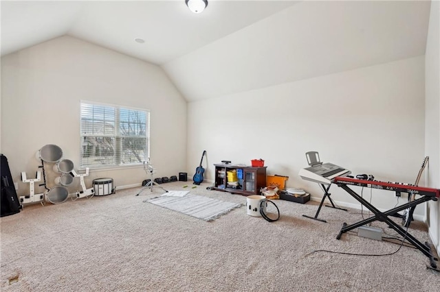 recreation room featuring lofted ceiling, carpet flooring, and baseboards