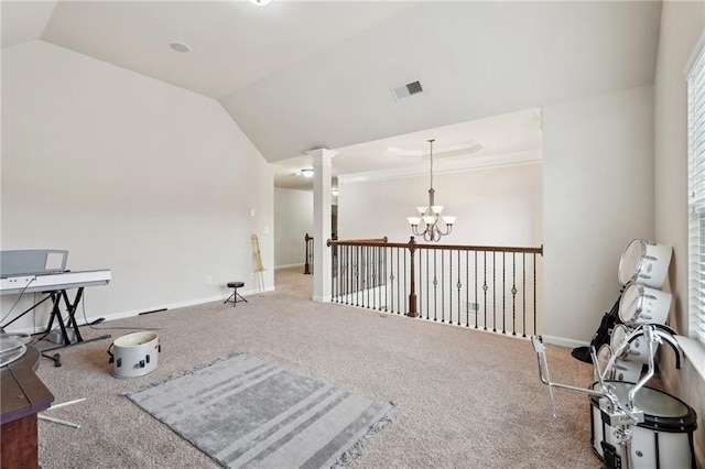 sitting room featuring lofted ceiling, carpet, and an inviting chandelier