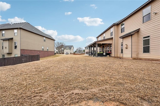 view of yard featuring a residential view and fence