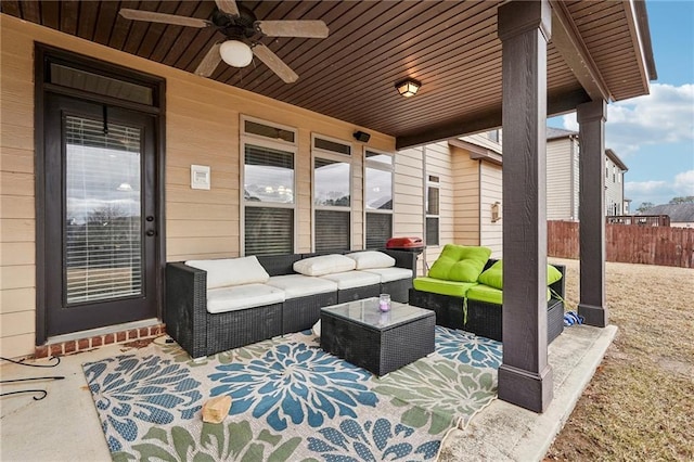 view of patio featuring ceiling fan, fence, and outdoor lounge area