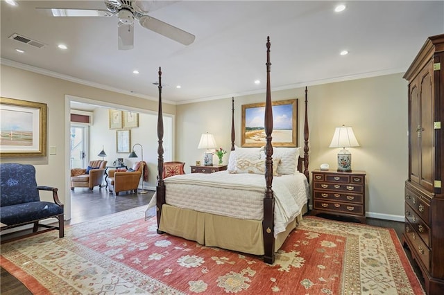 bedroom with visible vents, wood finished floors, and ornamental molding