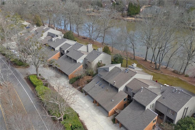 drone / aerial view featuring a water view and a residential view