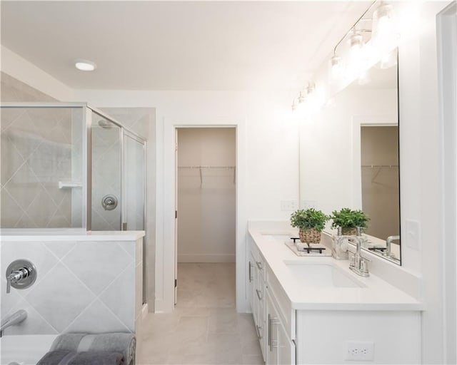 bathroom with vanity and an enclosed shower