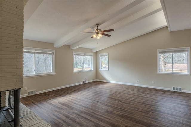 unfurnished living room with lofted ceiling with beams, ceiling fan, dark wood-type flooring, and a fireplace