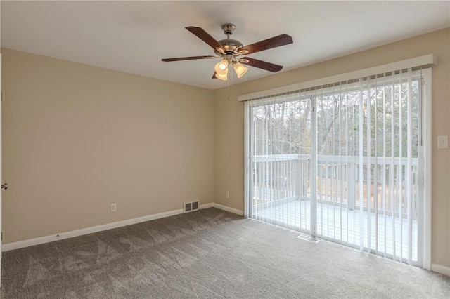 carpeted spare room with a wealth of natural light and ceiling fan