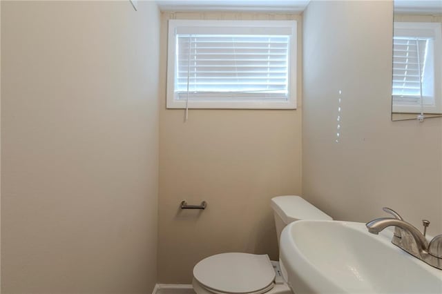 bathroom with toilet and sink