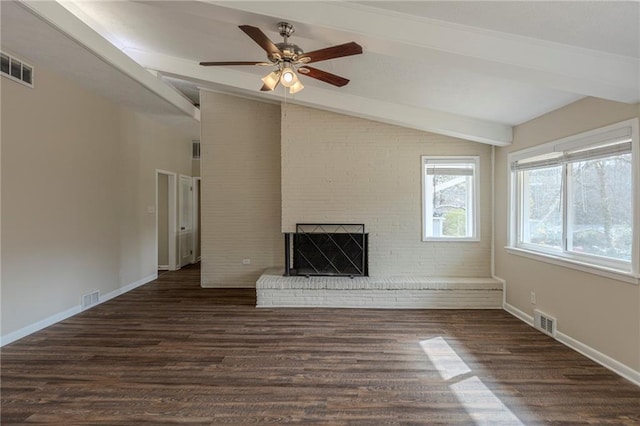 unfurnished living room featuring ceiling fan, vaulted ceiling with beams, dark wood-type flooring, and a fireplace