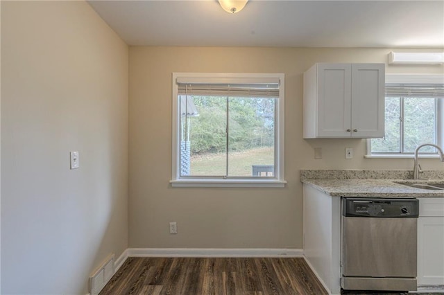 kitchen with sink, dark wood-type flooring, dishwasher, white cabinetry, and light stone countertops