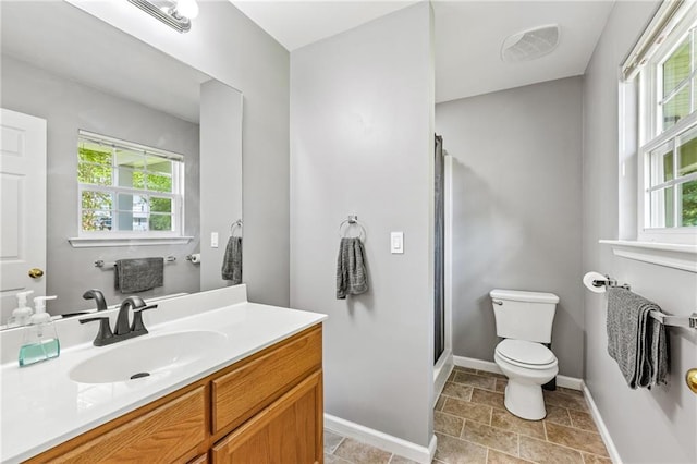 5706 Forest Pl, Acworth, GA 30102 - full bathroom featuring healthy amount of natural light, vanity, a stall shower, and stone finish flooring