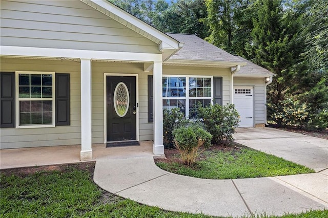 5706 Forest Pl, Acworth, GA 30102 - property entrance featuring a porch, driveway, and an attached garage