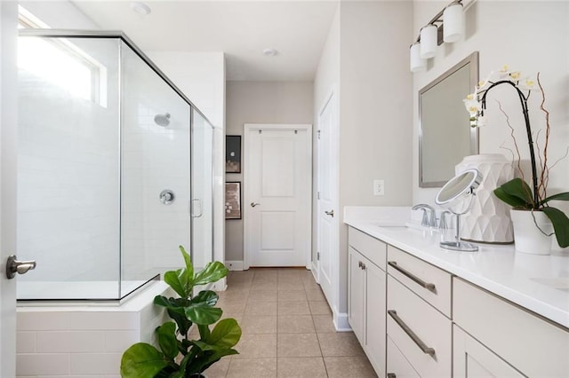 bathroom featuring vanity, tile patterned floors, and a shower with shower door