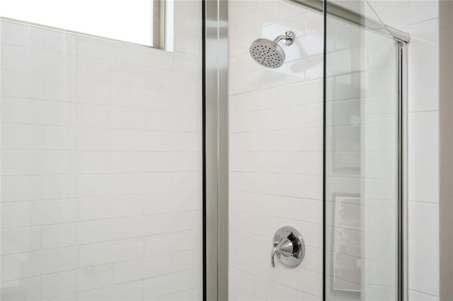 room details featuring a shower with shower door